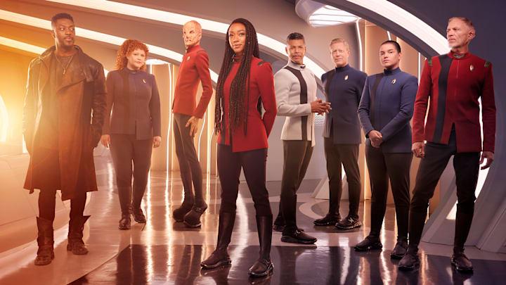 L-R David Ajala as Book, Mary Wiseman as Tilly, Doug Jones as Saru, Sonequa Martin-Green as Burnham, Wilson Cruz as Culber, Blu Del Barrio as Adira and Callum Keith Rennie as Raynor in season 5 of the Paramount+ original series STAR TREK: DISCOVERY. Photo Credit: James Dimmock/Paramount+