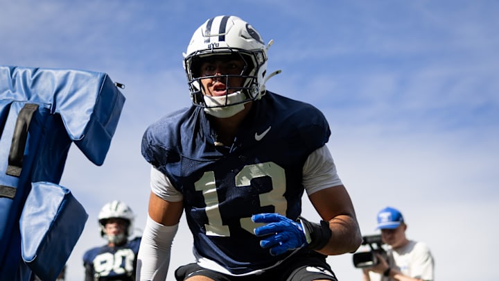 BYU defensive end Tausili Akana performs a drill during Spring Camp BYU defensive end Tausili Akana performs a drill during Spring Camp