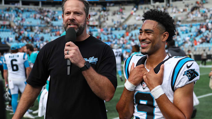 Oct 5, 2025; Charlotte, North Carolina, USA; Carolina Panthers quarterback Bryce Young (9) reacts during an interview following the game against the Miami Dolphins at Bank of America Stadium.
