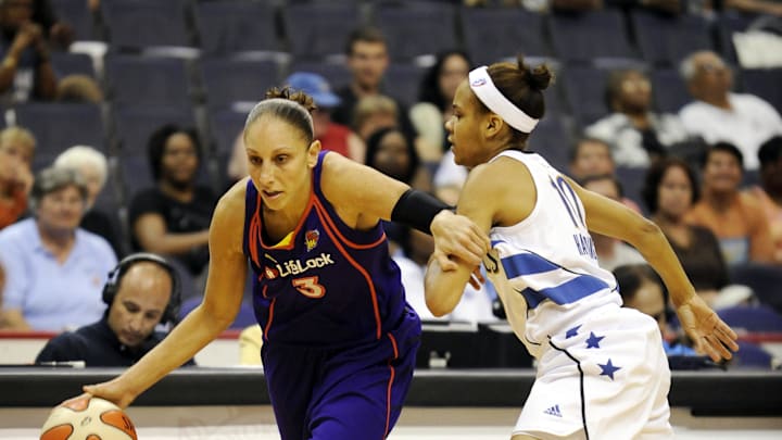 June 27, 2010; Washington, DC, USA; Phoenix Mercury guard Diana Taurasi (left) drives to the basket around Washington Mystics guard Lindsey Harding during the first half at the Verizon Center.  Mandatory Credit: Rafael Suanes-Imagn Images