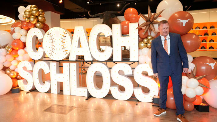 University of Texas baseball coach Jim Schlossnagle poses for photos at his introductory news conference at the Frank Denius Family University Hall of Fame Wednesday June 26, 2024.