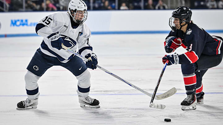 Penn State hockey player Tessa Janecke goes for the puck during a Nittany Lions hockey game. Penn State hockey player Tessa Janecke goes for the puck during a Nittany Lions hockey game.