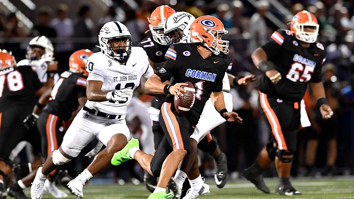 Bishop Gorman quarterback Ace Amina escapes pressure during the Gaels' victory over St. John Bosco on Friday. Bishop Gorman quarterback Ace Amina escapes pressure during the Gaels' victory over St. John Bosco on Friday.