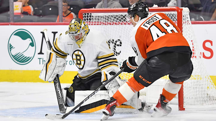 Oct 2, 2023; Philadelphia, Pennsylvania, USA; Boston Bruins goaltender Jeremy Swayman (1) makes a save against Philadelphia Flyers center Morgan Frost (48) during the second period at Wells Fargo Center. Mandatory Credit: Eric Hartline-Imagn Images