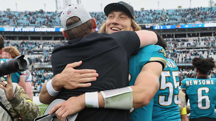 Jan 4, 2026; Jacksonville, Florida, USA; Jacksonville Jaguars quarterback Trevor Lawrence (16) celebrates with head coach Liam Coen (obscured) after the game against the Tennessee Titans at EverBank Stadium. Mandatory Credit: Morgan Tencza-Imagn Images Jan 4, 2026; Jacksonville, Florida, USA; Jacksonville Jaguars quarterback Trevor Lawrence (16) celebrates with head coach Liam Coen (obscured) after the game against the Tennessee Titans at EverBank Stadium. Mandatory Credit: Morgan Tencza-Imagn Images