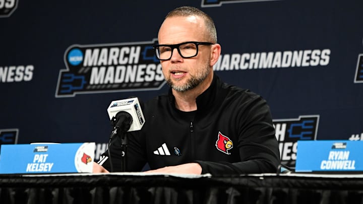 Mar 19, 2026; Buffalo, NY, USA; Louisville Cardinals head coach Pat Kelsey speaks at a postgame press conference after the game against the South Florida Bulls during a first round game of the men's 2026 NCAA Tournament at Keybank Center. Mandatory Credit: Mark Konezny-Imagn Images
