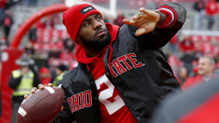 Nov 26, 2016; Columbus, OH, USA; Cleveland Cavaliers player LeBron James plays catch with the Ohio State Buckeyes team before the game against the Michigan Wolverines at Ohio Stadium. Mandatory Credit: Joe Maiorana-Imagn Images Nov 26, 2016; Columbus, OH, USA; Cleveland Cavaliers player LeBron James plays catch with the Ohio State Buckeyes team before the game against the Michigan Wolverines at Ohio Stadium. Mandatory Credit: Joe Maiorana-Imagn Images