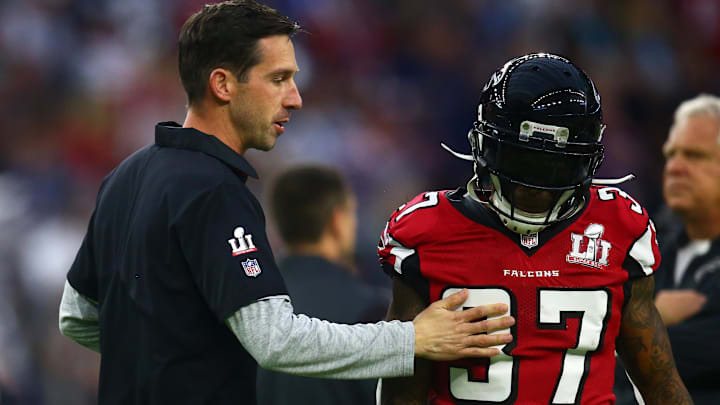 Atlanta Falcons offensive coordinator Kyle Shanahan talks with safety Ricardo Allen (37). Atlanta Falcons offensive coordinator Kyle Shanahan talks with safety Ricardo Allen (37).