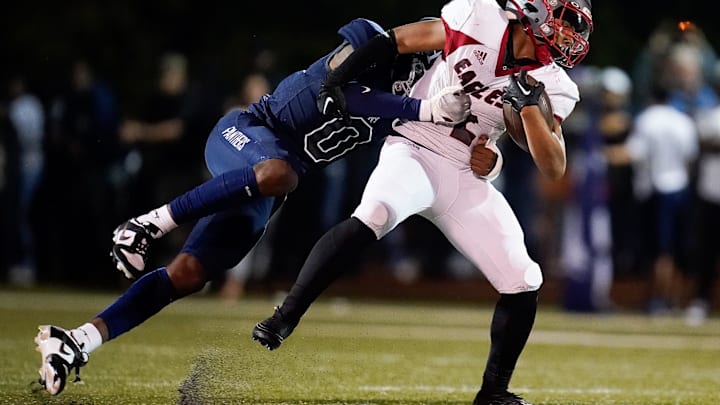 East Nashville's Keith Johnson Jr (2) tries to shake off FRA s Omarii Sanders (0) during the first quarter at Franklin Road Academy in Nashville, Tenn., Friday, Sept. 22, 2023. East Nashville's Keith Johnson Jr (2) tries to shake off FRA s Omarii Sanders (0) during the first quarter at Franklin Road Academy in Nashville, Tenn., Friday, Sept. 22, 2023.