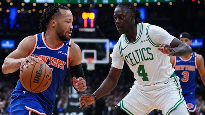 New York Knicks guard Jalen Brunson (11) drives the ball against Boston Celtics guard Jrue Holiday (4) in the first quarter during game one of the second round for the 2025 NBA Playoffs at TD Garden.