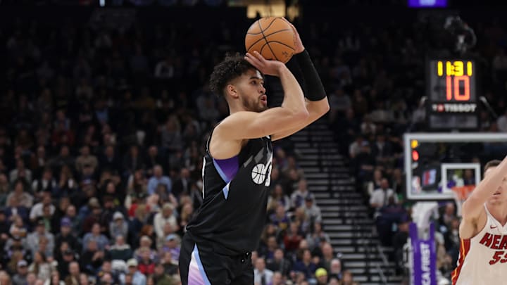 Jan 9, 2025; Salt Lake City, Utah, USA;  Utah Jazz guard Johnny Juzang (33) shoots the ball during the second half against the Miami Heat at Delta Center. Mandatory Credit: Chris Nicoll-Imagn Images