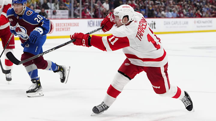 Mar 25, 2025; Denver, Colorado, USA; Detroit Red Wings right wing Vladimir Tarasenko (11) takes a shot on goal n the third period against the Colorado Avalanche at Ball Arena. Mandatory Credit: Ron Chenoy-Imagn Images