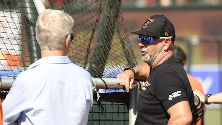 Jul 23, 2022; Baltimore, Maryland, USA; Baltimore Orioles manager Brandon Hyde (18) talks with General manager Mike Elias (left) during batting practice prior to a game between the Baltimore Orioles and the New York Yankees at Oriole Park at Camden Yards. Jul 23, 2022; Baltimore, Maryland, USA; Baltimore Orioles manager Brandon Hyde (18) talks with General manager Mike Elias (left) during batting practice prior to a game between the Baltimore Orioles and the New York Yankees at Oriole Park at Camden Yards.