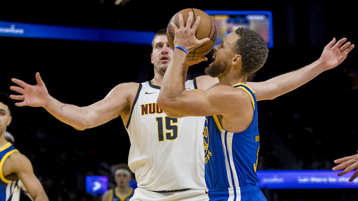 Jan 4, 2024; San Francisco, California, USA; Golden State Warriors guard Stephen Curry (30) is defended by Denver Nuggets center Nikola Jokic (15) during the second half at Chase Center. Mandatory Credit: John Hefti-Imagn Images Jan 4, 2024; San Francisco, California, USA; Golden State Warriors guard Stephen Curry (30) is defended by Denver Nuggets center Nikola Jokic (15) during the second half at Chase Center. Mandatory Credit: John Hefti-Imagn Images