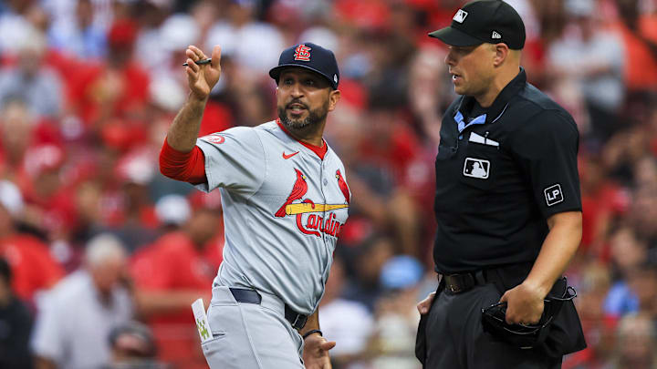 Aug 12, 2024; Cincinnati, Ohio, USA; St. Louis Cardinals manager Oliver Marmol (37) argues with home plate umpire Stu Scheurwater (85) in the fifth inning against the Cincinnati Reds at Great American Ball Park. Mandatory Credit: Katie Stratman-Imagn Images