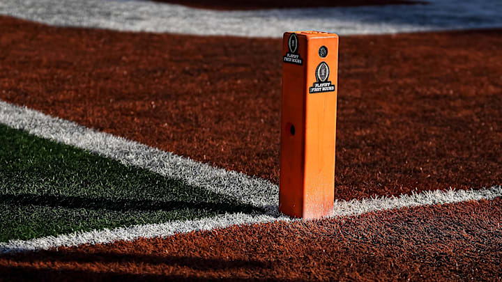 College Football Playoff logos are added to pylons during the game between the Texas Longhorns and Clemson in the first round of the College Football Playoffs at Darrell K Royal-Texas Memorial Stadium on Saturday, Dec. 21, 2024. College Football Playoff logos are added to pylons during the game between the Texas Longhorns and Clemson in the first round of the College Football Playoffs at Darrell K Royal-Texas Memorial Stadium on Saturday, Dec. 21, 2024.