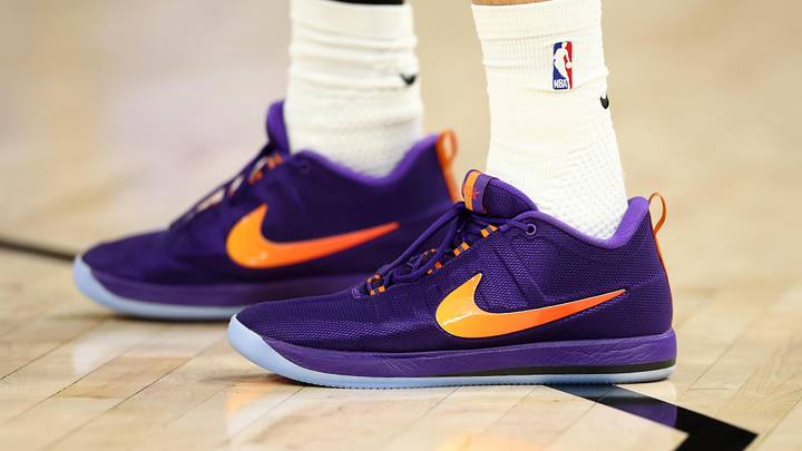 Devin Booker wears the Nike Book 2 "Sunburst" colorway.
