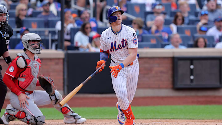 Jul 19, 2025; New York City, New York, USA; New York Mets second baseman Brett Baty (7) follows through on a solo home run against the Cincinnati Reds during the second inning at Citi Field. Mandatory Credit: Brad Penner-Imagn Images