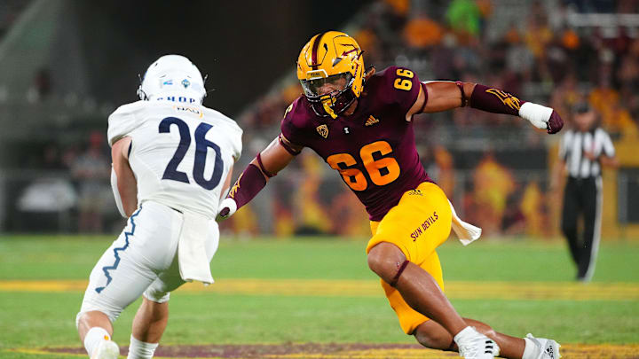September 1, 2022; Tempe, Arizona; USA; ASU linebacker James Djonkam (66) tackles NAU runningback Draycen Hall (26) during a game at Sun Devil Stadium.

Football Asu Fb Nau At Asu