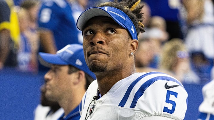 Dual threat QB Anthony Richardson checks the time in a preseason game with the Bears last year.