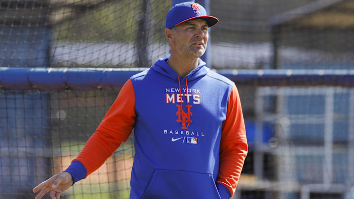 Mar 13, 2022; Port St. Lucie, FL, USA; New York Mets hitting coach Eric Chavez looks on as players take batting practice during spring training. Mandatory Credit: Sam Navarro-Imagn Images