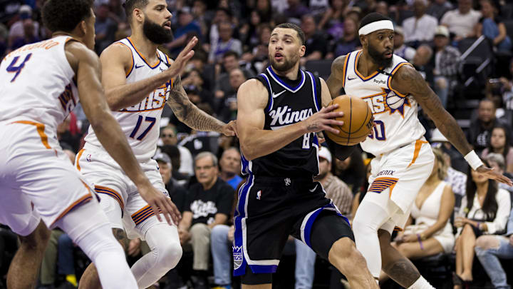Apr 13, 2025; Sacramento, California, USA;  Sacramento Kings guard Zach LaVine (8) looks top as Phoenix Suns guard Cody Martin (17) defends during the first quarter at Golden 1 Center. Mandatory Credit: John Hefti-Imagn Images