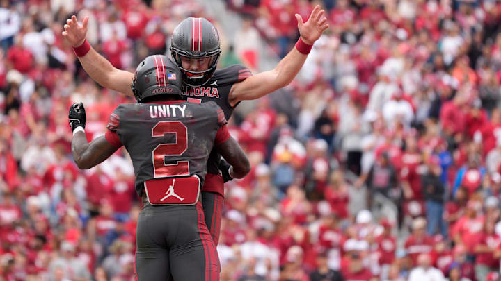 Oklahoma Sooners quarterback Jackson Arnold celebrates with running back Jovantae Barnes after Barnes ran for a touchdown against Maine. Oklahoma Sooners quarterback Jackson Arnold celebrates with running back Jovantae Barnes after Barnes ran for a touchdown against Maine.