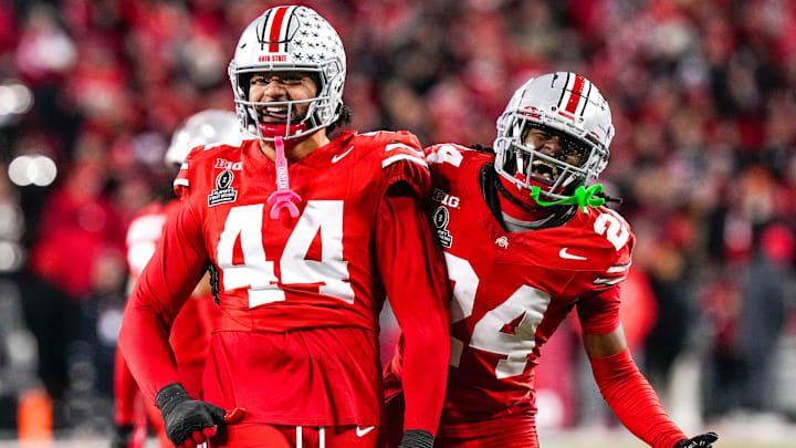 Ohio State Buckeyes defensive end JT Tuimoloau (44) and cornerback Jermaine Mathews Jr. (24) celebrate in the second half at Ohio Stadium on Saturday, Dec. 21, 2024 in Columbus, Ohio.