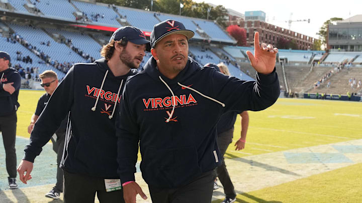 Oct 25, 2025; Chapel Hill, North Carolina, USA; Virginia Cavaliers head coach Tony Elliott runs off the field after defeating the North Carolina Tar Heels in overtime at Kenan Stadium. Mandatory Credit: Bob Donnan-Imagn Images