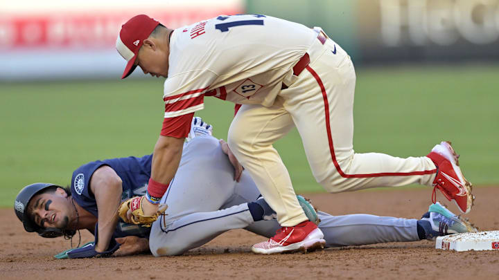 Jul 13, 2024; Anaheim, California, USA; Josh Rojas #4 of the Seattle Mariners is caught stealing on tag by Keston Hiura #13 of the Los Angeles Angels in the second inning at Angel Stadium. Mandatory Credit: Jayne Kamin-Oncea-Imagn Images Jul 13, 2024; Anaheim, California, USA; Josh Rojas #4 of the Seattle Mariners is caught stealing on tag by Keston Hiura #13 of the Los Angeles Angels in the second inning at Angel Stadium. Mandatory Credit: Jayne Kamin-Oncea-Imagn Images