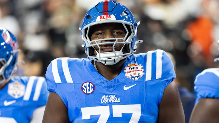 Jan 8, 2026; Glendale, AZ, USA; Mississippi Rebels offensive lineman Ethan Fields (77) against the Miami Hurricanes during the 2026 Fiesta Bowl and semifinal game of the College Football Playoff at State Farm Stadium. Mandatory Credit: Mark J. Rebilas-Imagn Images