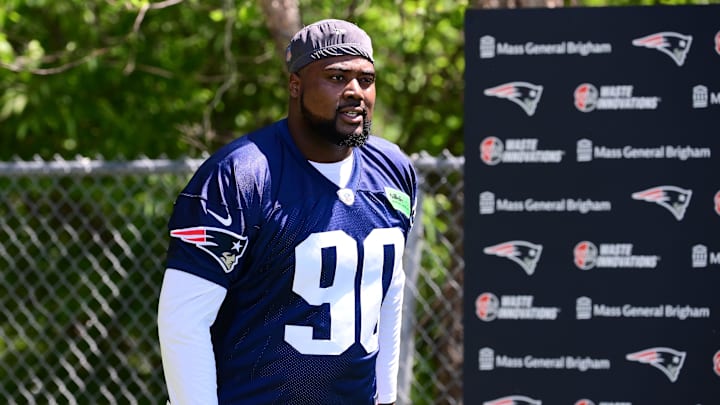 Jun 10, 2024; Foxborough, MA, USA; New England Patriots defensive tackle Christian Barmore (90) walks to the practice fields for minicamp at Gillette Stadium.