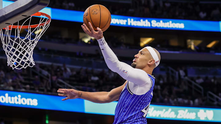 Mar 1, 2026; Orlando, Florida, USA; Orlando Magic guard Jalen Suggs (4) goes to the basket during the second half against the Detroit Pistons at Kia Center. Mandatory Credit: Mike Watters-Imagn Images