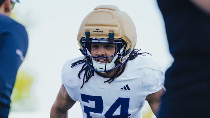 Makell Esteen waits for his turn in a UW spring drill.