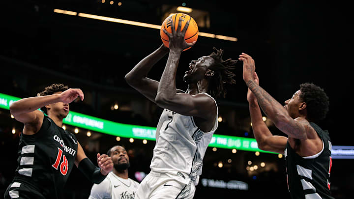 Mar 11, 2026; Kansas City, MO, USA; UCF Knights center John Bol (7) shoots the ball during the first half against the Cincinnati Bearcats at T-Mobile Center. Mandatory Credit: William Purnell-Imagn Images