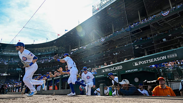 Oct 1, 2025; Chicago, Illinois, USA; Chicago Cubs infielder Dansby Swanson (7) and Pete Crow-Armstrong (4) (right) head out of the dugout 