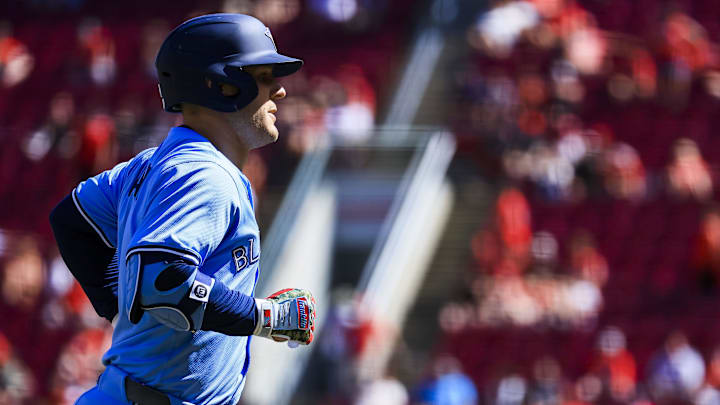 Toronto Blue Jays outfielder Daulton Varsho (5) runs the bases after hitting a solo home run in the ninth inning against the Cincinnati Reds at Great American Ball Park. 