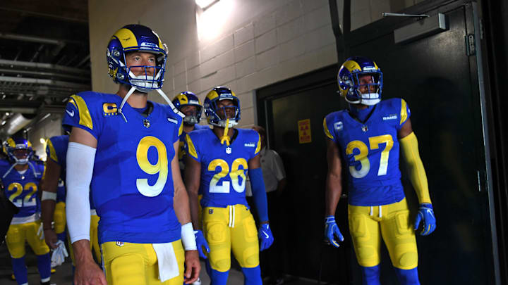 Sep 21, 2025; Philadelphia, Pennsylvania, USA; Los Angeles Rams quarterback Matthew Stafford (9), safety Kamren Kinchens (26) and safety Quentin Lake (37) wait in the tunnel against the Philadelphia Eagles at Lincoln Financial Field. Mandatory Credit: Eric Hartline-Imagn Images
