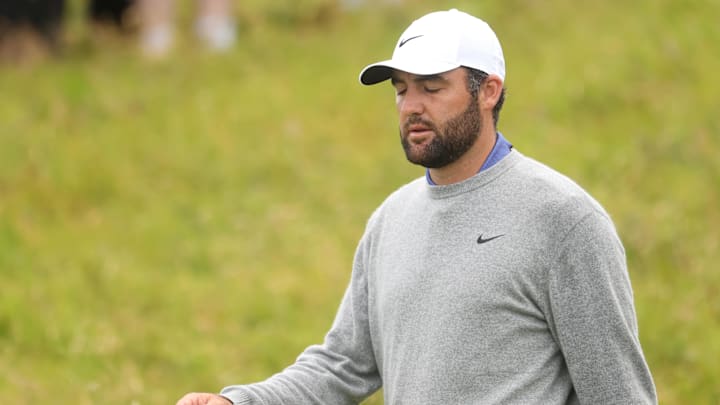 Scottie Scheffler reacts after missing a putt on the 14th hole during the first round of the British Open on Thursday. Scottie Scheffler reacts after missing a putt on the 14th hole during the first round of the British Open on Thursday.