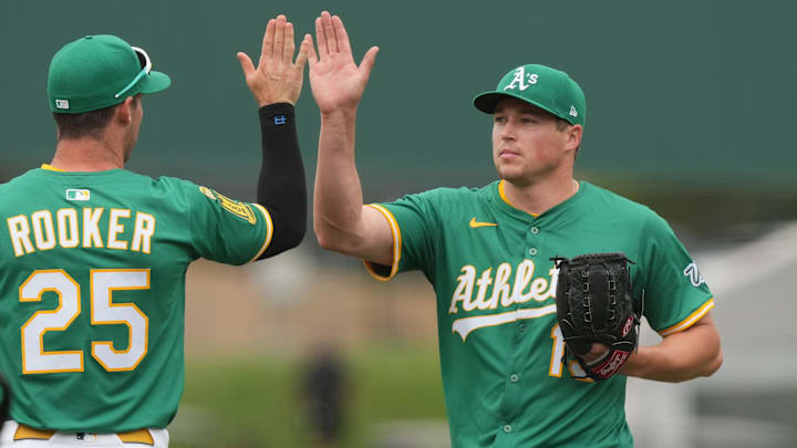 Jun 8, 2025; West Sacramento, California, USA; Athletics pitcher Mason Miller (right) celebrates with designated hitter Brent Rooker (25) after defeating the Baltimore Orioles at Sutter Health Park. Mandatory Credit: Darren Yamashita-Imagn Images