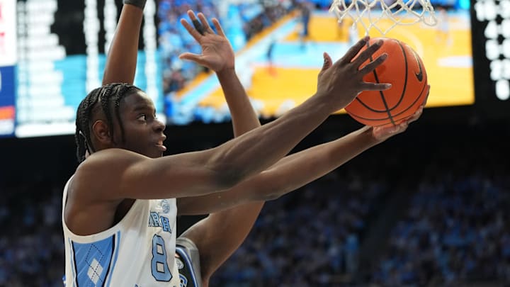 Feb 7, 2026; Chapel Hill, North Carolina, USA;  North Carolina Tar Heels forward Caleb Wilson (8) shoots as Duke Blue Devils center Patrick Ngongba (21) defends in the second half at Dean E. Smith Center. Mandatory Credit: Bob Donnan-Imagn Images
