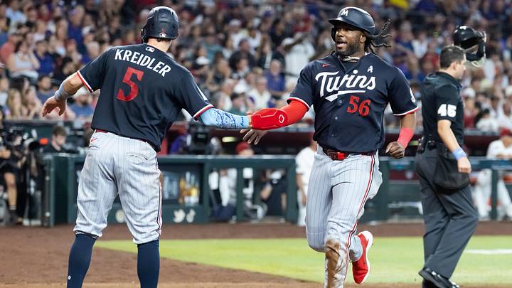 Jun 21, 2026; Phoenix, Arizona, USA; Minnesota Twins outfielder Josh Bell celebrates with Ryan Kreidler after scoring in the seventh inning against the Arizona Diamondbacks at Chase Field. Jun 21, 2026; Phoenix, Arizona, USA; Minnesota Twins outfielder Josh Bell celebrates with Ryan Kreidler after scoring in the seventh inning against the Arizona Diamondbacks at Chase Field.