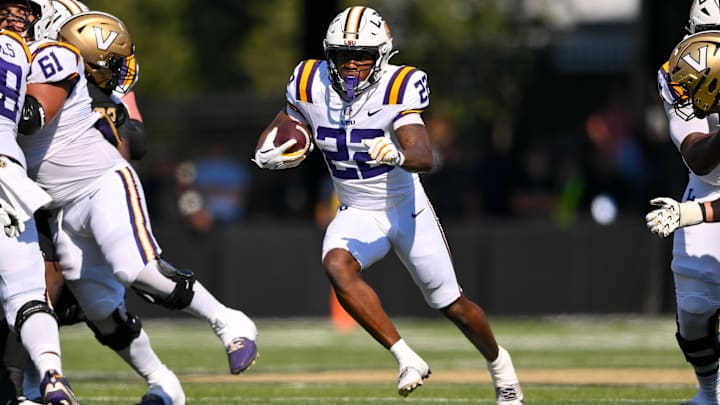 Oct 18, 2025; Nashville, Tennessee, USA;  Louisiana State Tigers running back Harlem Berry (22) runs with the ball against the Vanderbilt Commodores during the first half at FirstBank Stadium. Mandatory Credit: Steve Roberts-Imagn Images