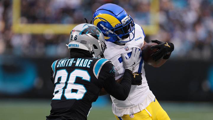 Rams wide receiver Davante Adams (17) runs after making a catch as Carolina Panthers cornerback Chau Smith-Wade (26) defends Rams wide receiver Davante Adams (17) runs after making a catch as Carolina Panthers cornerback Chau Smith-Wade (26) defends