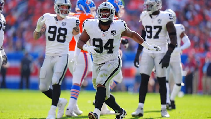 Las Vegas Raiders defensive tackle Christian Wilkins (94) celebrates his sack in the second quarter against the Denver Broncos at Empower Field at Mile High.