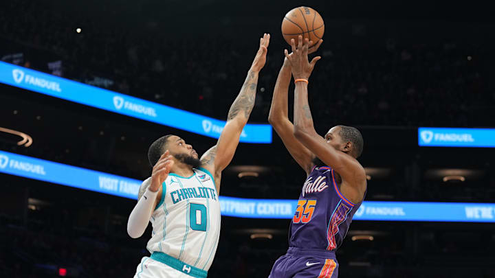 Dec 29, 2023; Phoenix, Arizona, USA; Phoenix Suns forward Kevin Durant (35) shoots over Charlotte Hornets forward Miles Bridges (0) during the second half at Footprint Center. Mandatory Credit: Joe Camporeale-Imagn Images Dec 29, 2023; Phoenix, Arizona, USA; Phoenix Suns forward Kevin Durant (35) shoots over Charlotte Hornets forward Miles Bridges (0) during the second half at Footprint Center. Mandatory Credit: Joe Camporeale-Imagn Images