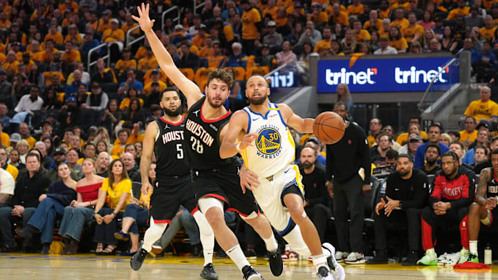 Golden State Warriors guard Stephen Curry (30) dribbles against Houston Rockets center Alperen Sengun (28) during the second quarter of game three of first round for the 2024 NBA Playoffs at Chase Center. Mandatory Credit: Darren Yamashita-Imagn Images