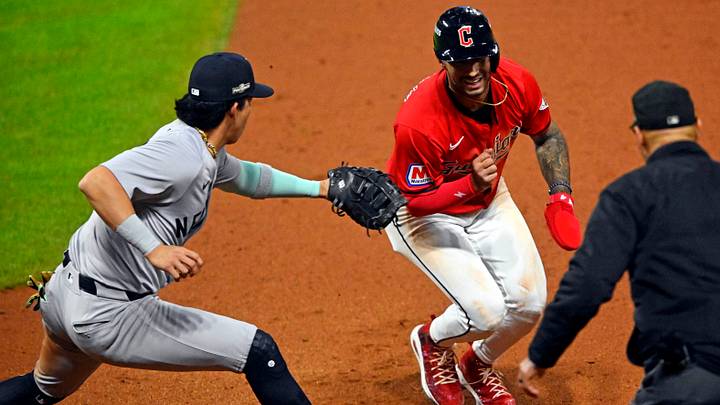Oct 19, 2024: Cleveland Guardians shortstop Brayan Rocchio (4) is tagged out by New York Yankees first base Oswaldo Cabrera (95) during the seventh inning during game five of the ALCS for the 2024 MLB playoffs at Progressive Field. Credit: David Richard-Imagn Images