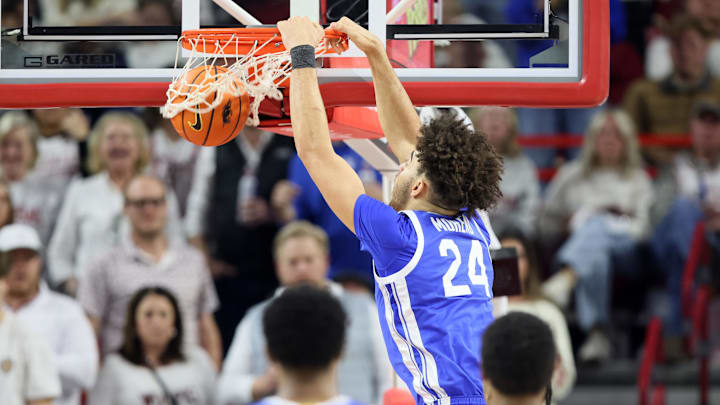 Jan 31, 2026; Fayetteville, Arkansas, USA; Kentucky Wildcats center Malachi Moreno (24) dunks the ball during the second half against the Arkansas Razorbacks at Bud Walton Arena. Kentucky won 85-77. Mandatory Credit: Nelson Chenault-Imagn Images