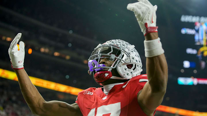 Ohio State Buckeyes wide receiver Carnell Tate (17) celebrates a touchdown Saturday, Dec. 6, 2025, during the Big Ten football championship against the Indiana Hoosiers